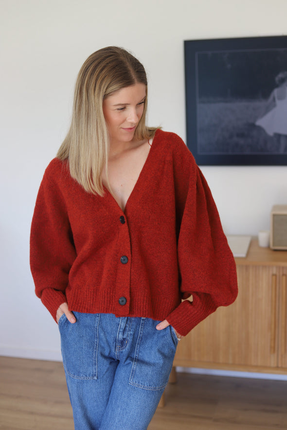 A deep v-neck, soft blouson sleeve and cropped length ensures the wander is both chic yet casual. wear this versatile knit alone as a fashion statement, or as a layering piece
