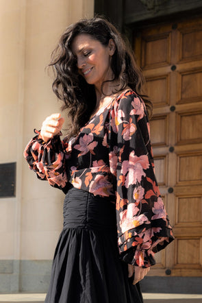The 'nice top' to go with your jeans. Look no further the Botanical Blouse by The Bay is exactly that! Featuring a black base with a pink and autumnal tone print. V neck and a flowy sleeve with a beautiful drape. Pleated cuff with an elastic band allows you to create the fullness of the sleeve you wish. Style easily with your denim or elevate the look with a dressier pant for work or a night out!