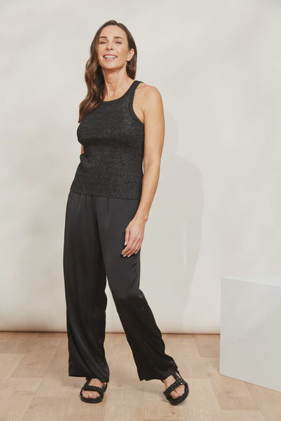 Take your casual wardrobe to the next level with the Lujo Tank. It features a round neck and sleeveless design in a fitted rib-knit that's both comfy and stylish. But here's the best part: it's threaded with shimmering lurex that catches the light and adds a touch of sparkle to your look! Wear it as it is with shorts and slides during warmer days, or layer it with an open button-down shirt and loose pants for an effortless transeasonal look.