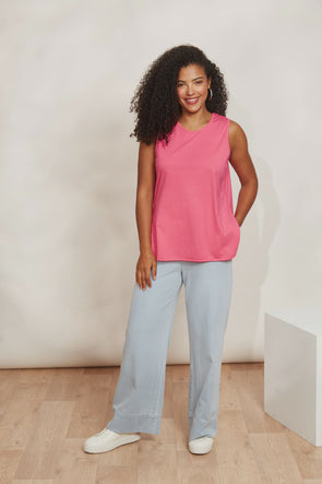 The Verano Tank is all about comfort and versatility, crafted with soft and stretchy cotton. Its sleeveless design and relaxed silhouette make it ideal for standalone wear or layering to elevate an outfit. With its adaptable style, the Verano Tank pairs effortlessly with jeans for a casual vibe or tucked into a maxi skirt or wide-leg trousers for a more polished look.