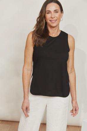 The Verano Tank is all about comfort and versatility, crafted with soft and stretchy cotton. Its sleeveless design and relaxed silhouette make it ideal for standalone wear or layering to elevate an outfit. With its adaptable style, the Verano Tank pairs effortlessly with jeans for a casual vibe or tucked into a maxi skirt or wide-leg trousers for a more polished look.