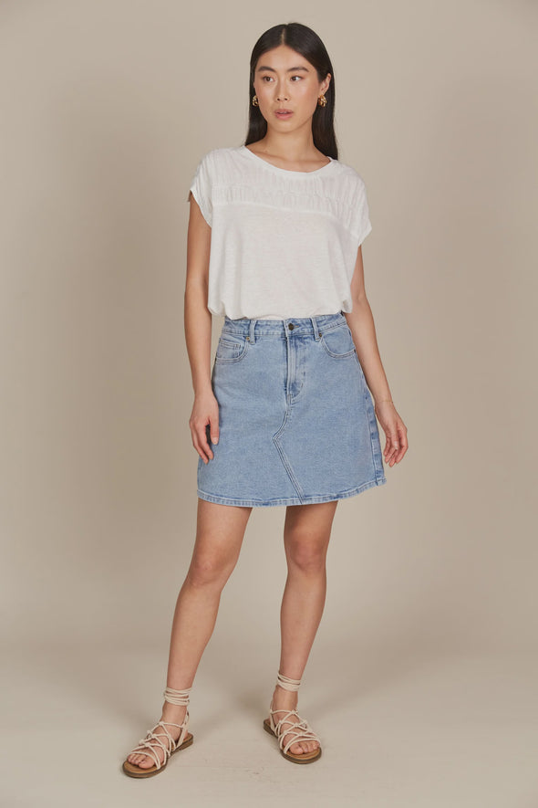 If you prefer skirts to pants, the Margot Denim Skirt is your go-to for laid-back days. This denim skirt features a mid-rise fit, button and zipper fly, and classic five-pocket styling. Falling to a comfortable mid-thigh length, it has the right amount of stretch for all-day comfort. Whether you pair it with a tank, t-shirt, button-down, or blouse, you'll always look chic and stylish!