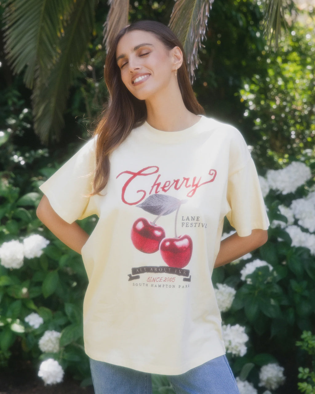 Introducing the Pippa Relaxed Tee in Yellow, designed to add a subtle pop of yellow to your wardrobe. Crafted from cotton, it features a relaxed fit silhouette with an All About Eve exclusive cherry graphic, delivering comfort and effortless wear. Style it casually for brunch with the girls, or pair it back with your favourite denim jeans for relaxed family gatherings.