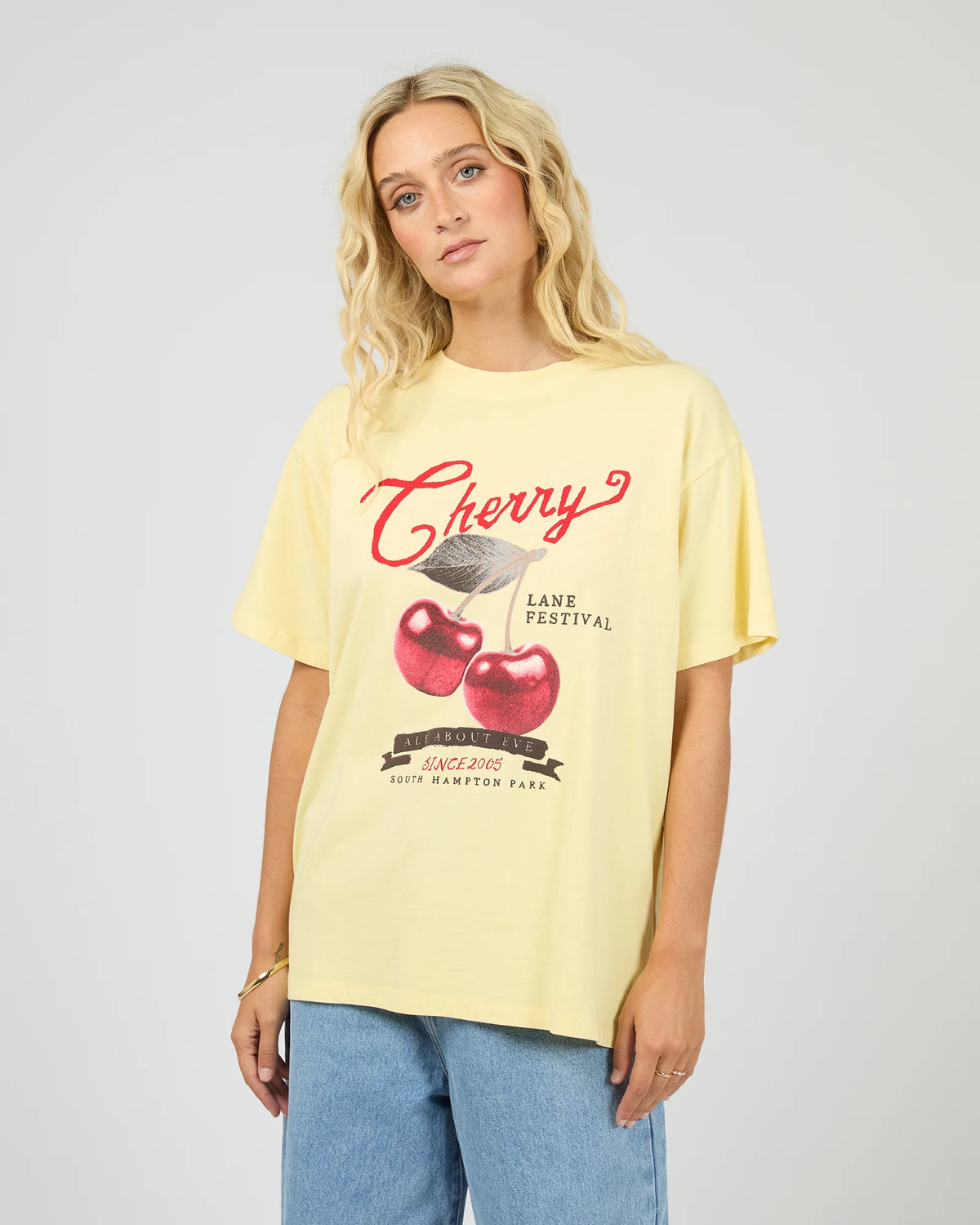 Introducing the Pippa Relaxed Tee in Yellow, designed to add a subtle pop of yellow to your wardrobe. Crafted from cotton, it features a relaxed fit silhouette with an All About Eve exclusive cherry graphic, delivering comfort and effortless wear. Style it casually for brunch with the girls, or pair it back with your favourite denim jeans for relaxed family gatherings.