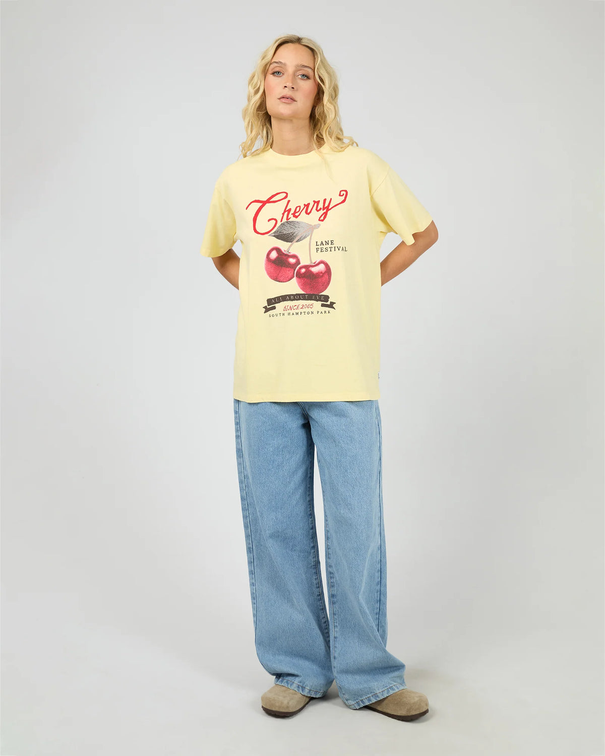 Introducing the Pippa Relaxed Tee in Yellow, designed to add a subtle pop of yellow to your wardrobe. Crafted from cotton, it features a relaxed fit silhouette with an All About Eve exclusive cherry graphic, delivering comfort and effortless wear. Style it casually for brunch with the girls, or pair it back with your favourite denim jeans for relaxed family gatherings.