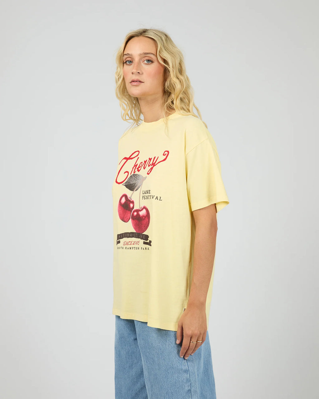 Introducing the Pippa Relaxed Tee in Yellow, designed to add a subtle pop of yellow to your wardrobe. Crafted from cotton, it features a relaxed fit silhouette with an All About Eve exclusive cherry graphic, delivering comfort and effortless wear. Style it casually for brunch with the girls, or pair it back with your favourite denim jeans for relaxed family gatherings.