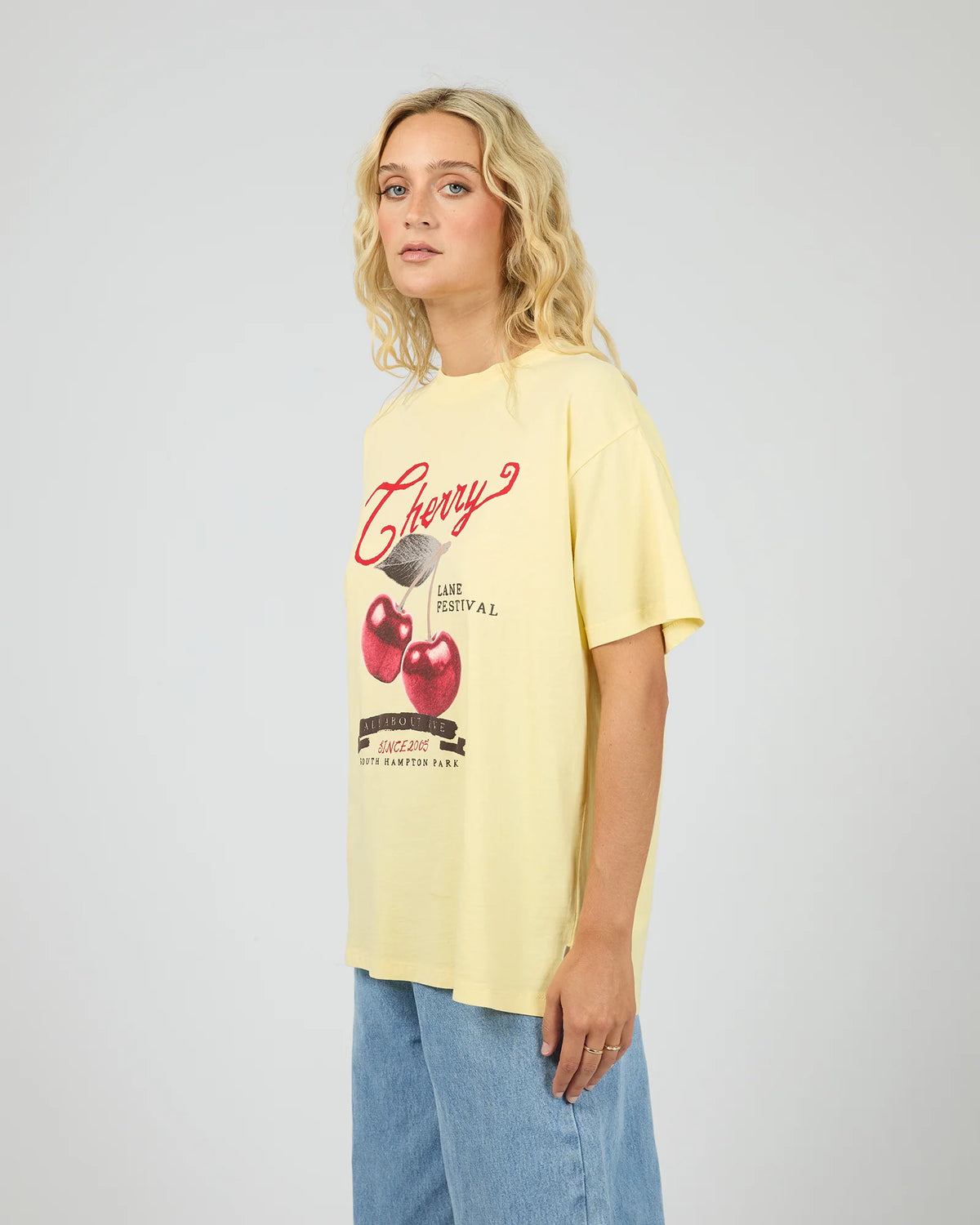 Introducing the Pippa Relaxed Tee in Yellow, designed to add a subtle pop of yellow to your wardrobe. Crafted from cotton, it features a relaxed fit silhouette with an All About Eve exclusive cherry graphic, delivering comfort and effortless wear. Style it casually for brunch with the girls, or pair it back with your favourite denim jeans for relaxed family gatherings.
