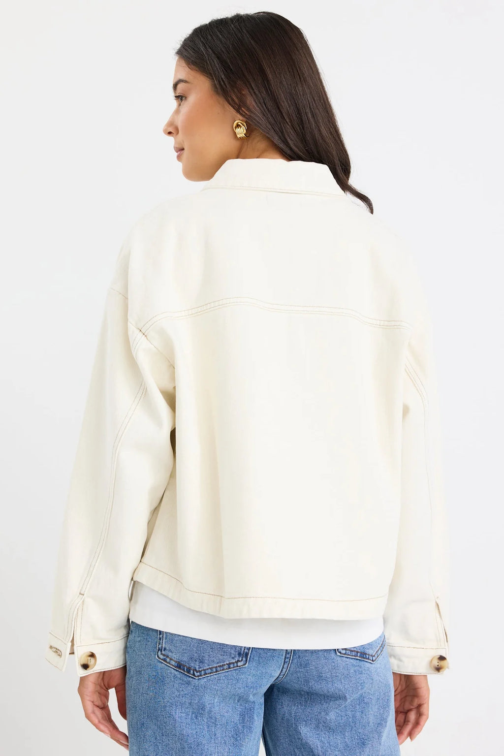 - Long sleeve relaxed silhouette
- Button front closure with contrast stitching
- Patch pockets for a utility inspired finish
- Full length hem, ideal for layering
- Fabric composition: 100% cotton