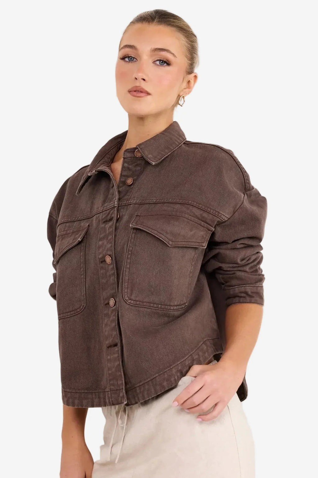 - Long sleeve relaxed silhouette
- Button front closure with contrast stitching
- Patch pockets for a utility inspired finish
- Full length hem, ideal for layering
- Fabric composition: 100% cotton
