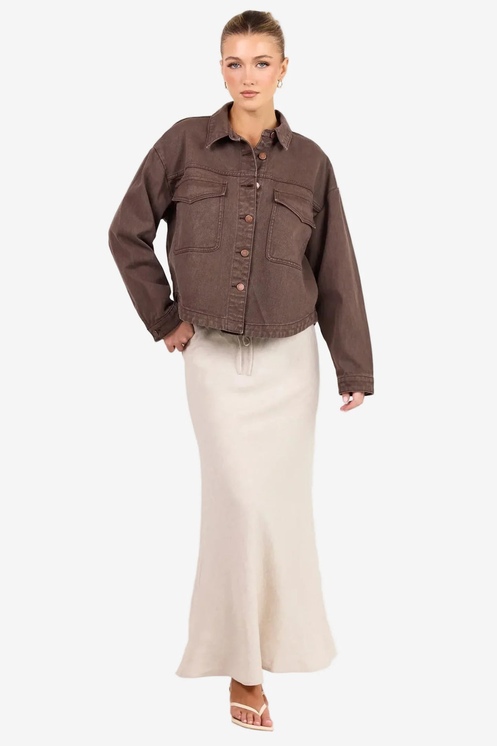 - Long sleeve relaxed silhouette
- Button front closure with contrast stitching
- Patch pockets for a utility inspired finish
- Full length hem, ideal for layering
- Fabric composition: 100% cotton

