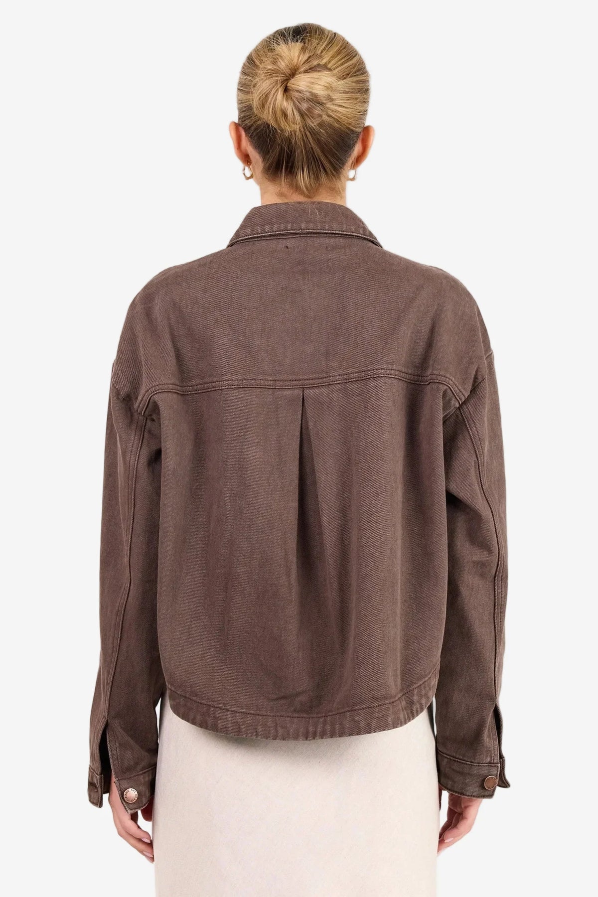 - Long sleeve relaxed silhouette
- Button front closure with contrast stitching
- Patch pockets for a utility inspired finish
- Full length hem, ideal for layering
- Fabric composition: 100% cotton
