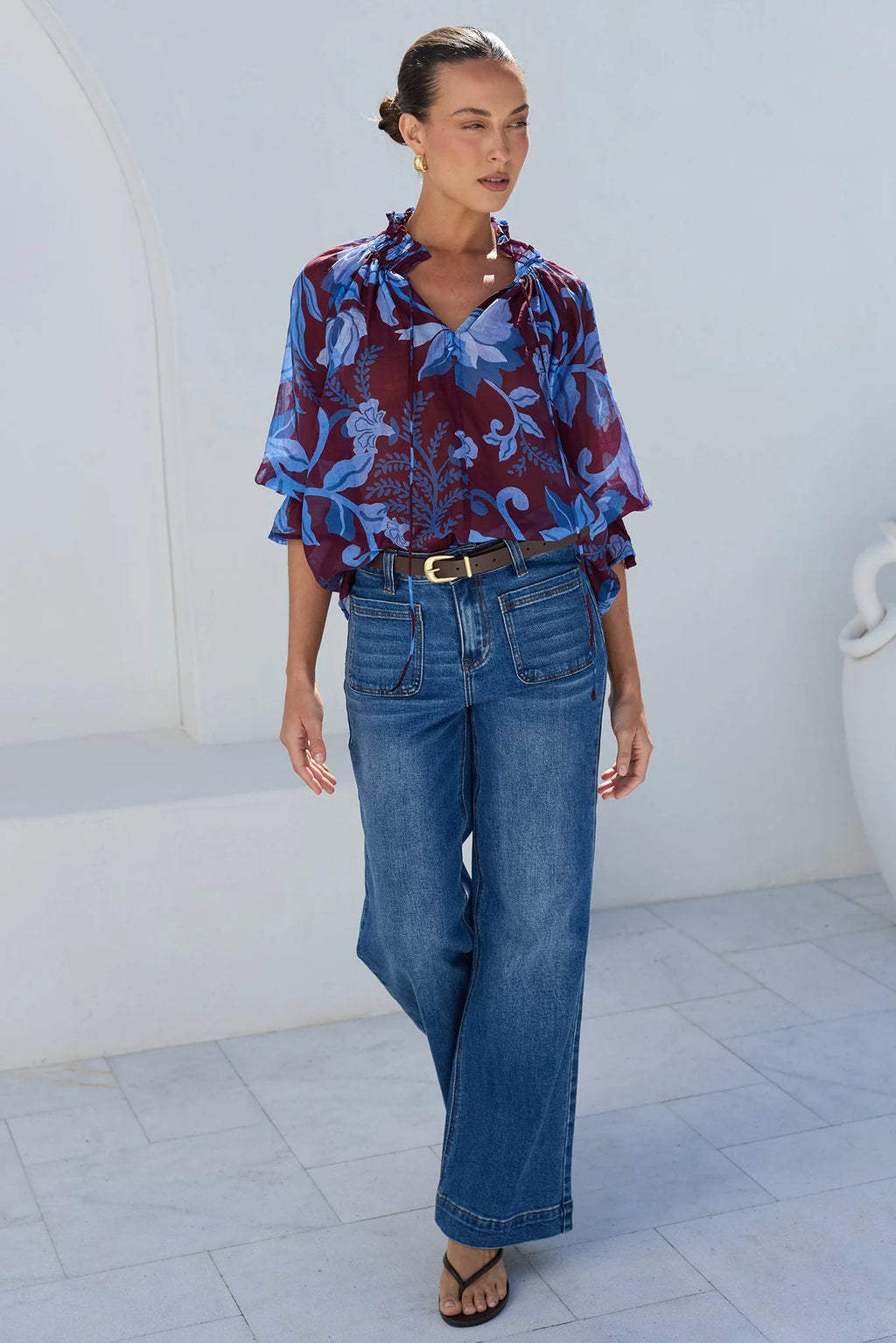 - V-neckline
- Shirred neckline
- Short puff sleeves
- Shirred cuffs with frill detailing
- Delicate front button detail
- Adjustable neckline ties
- Relaxed oversized fit
- Delicate garment care
- Fabric Composition - 80% Viscose 20% Nylon