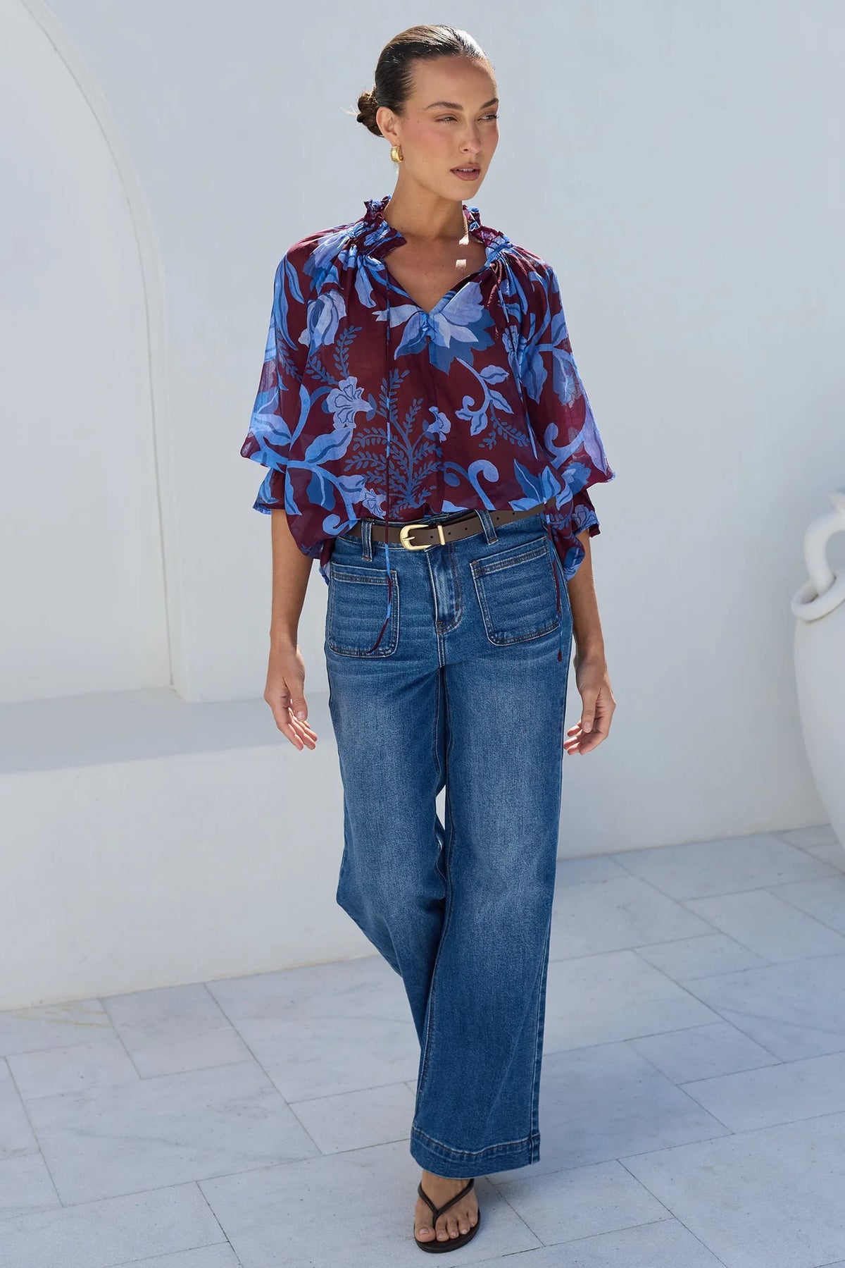- V-neckline
- Shirred neckline
- Short puff sleeves
- Shirred cuffs with frill detailing
- Delicate front button detail
- Adjustable neckline ties
- Relaxed oversized fit
- Delicate garment care
- Fabric Composition - 80% Viscose 20% Nylon