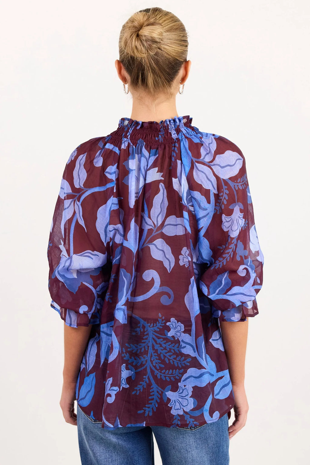 - V-neckline
- Shirred neckline
- Short puff sleeves
- Shirred cuffs with frill detailing
- Delicate front button detail
- Adjustable neckline ties
- Relaxed oversized fit
- Delicate garment care
- Fabric Composition - 80% Viscose 20% Nylon