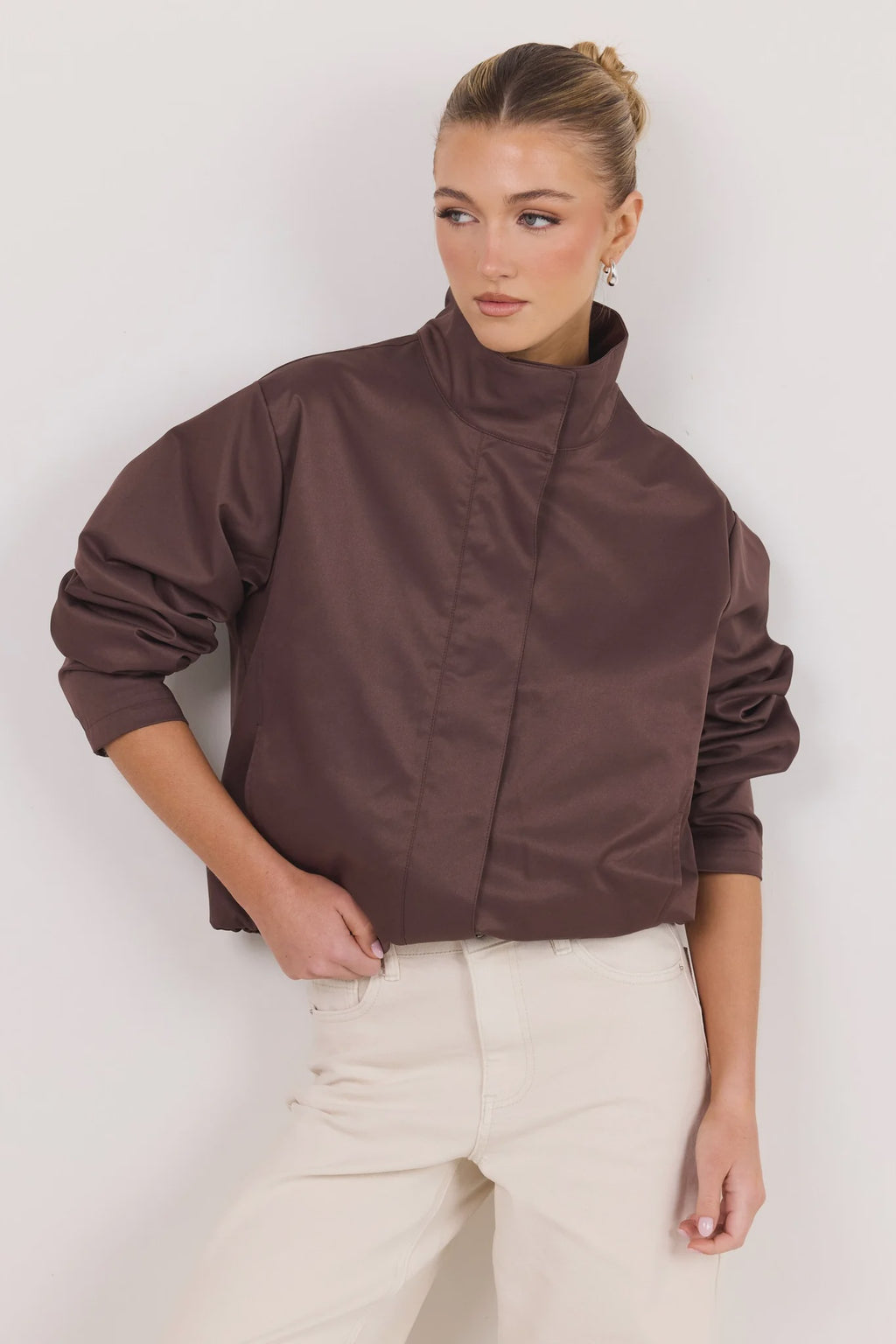 - Funnel neckline
- Long sleeves
- Concealed front fastening
- Relaxed oversized fit
- Side pockets
- Cropped length
- Fabric Composition - 100% Polyester