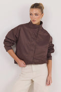 - Funnel neckline
- Long sleeves
- Concealed front fastening
- Relaxed oversized fit
- Side pockets
- Cropped length
- Fabric Composition - 100% Polyester