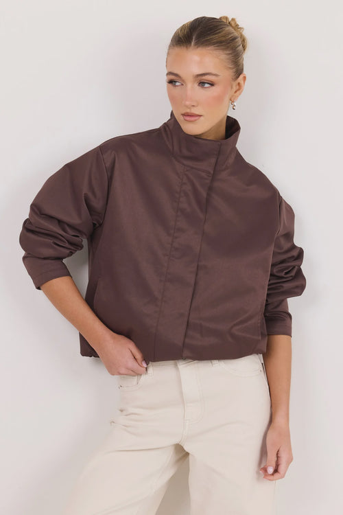 - Funnel neckline
- Long sleeves
- Concealed front fastening
- Relaxed oversized fit
- Side pockets
- Cropped length
- Fabric Composition - 100% Polyester