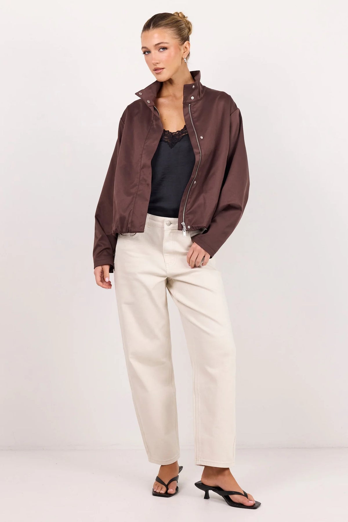 - Funnel neckline
- Long sleeves
- Concealed front fastening
- Relaxed oversized fit
- Side pockets
- Cropped length
- Fabric Composition - 100% Polyester