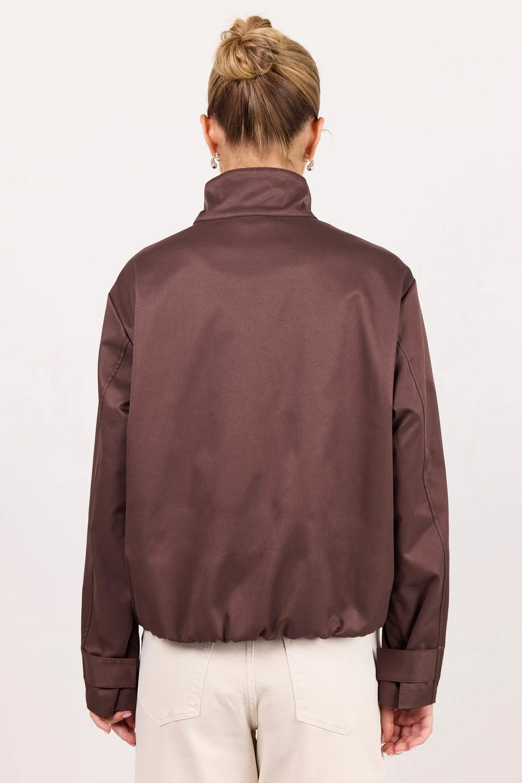 - Funnel neckline
- Long sleeves
- Concealed front fastening
- Relaxed oversized fit
- Side pockets
- Cropped length
- Fabric Composition - 100% Polyester
