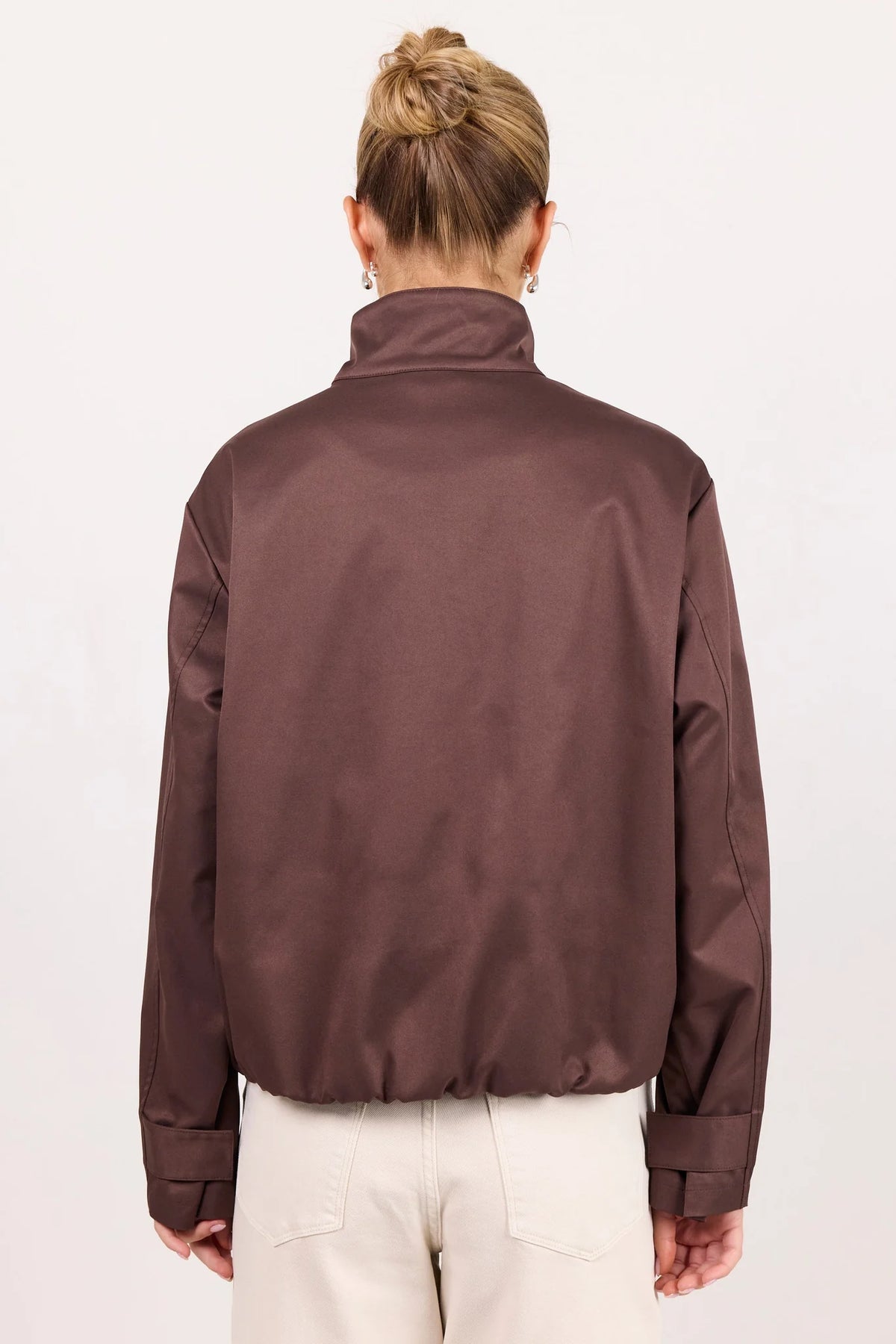 - Funnel neckline
- Long sleeves
- Concealed front fastening
- Relaxed oversized fit
- Side pockets
- Cropped length
- Fabric Composition - 100% Polyester