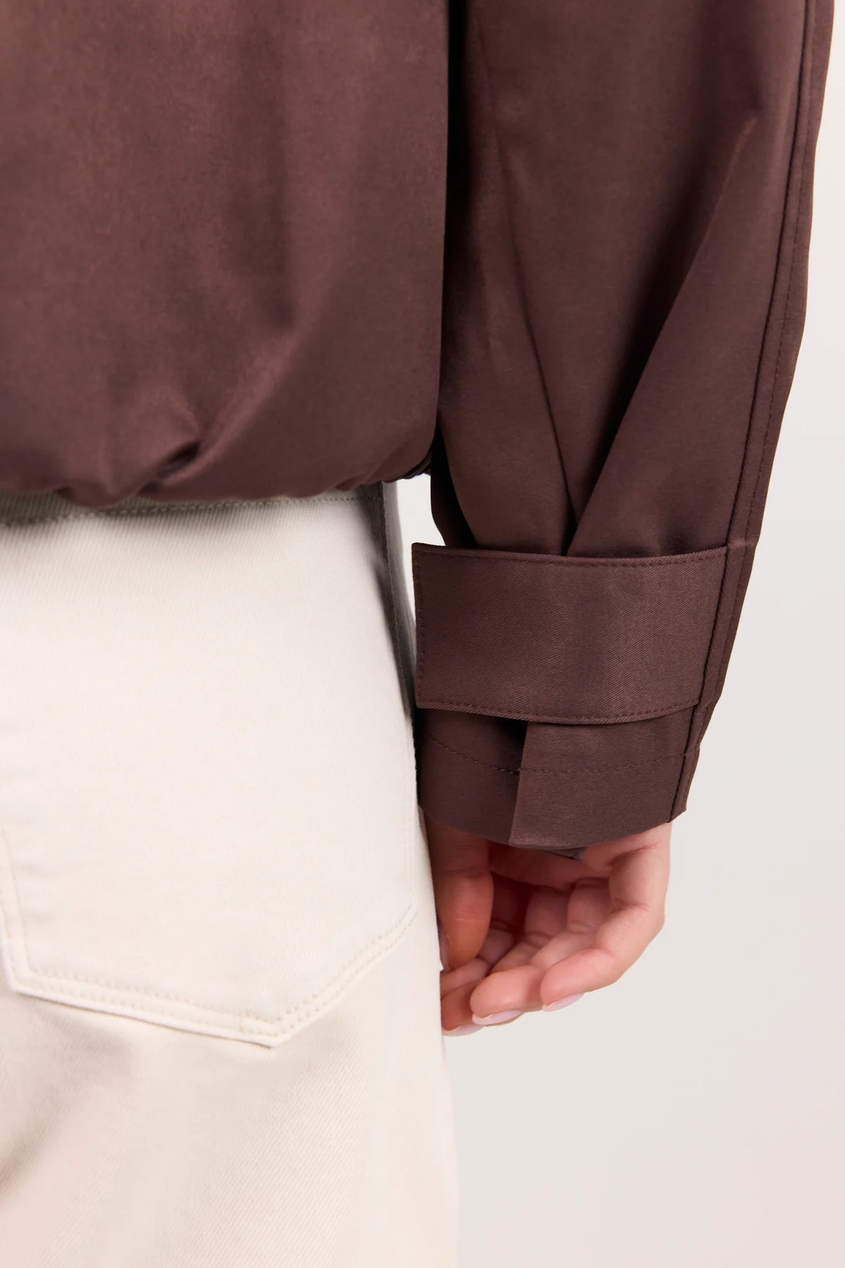 - Funnel neckline
- Long sleeves
- Concealed front fastening
- Relaxed oversized fit
- Side pockets
- Cropped length
- Fabric Composition - 100% Polyester