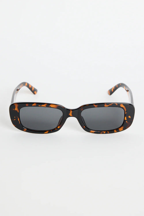 The Malibu Brown Tort Sunglasses bring bold, retro-cool energy to your everyday looks. Featuring a striking tortoiseshell frame and a sleek rectangular silhouette, they balance fashion-forward attitude with easy wearability. The dark tinted lenses keep the finish sharp and versatile, making this pair a go-to for sunny days, weekend plans, and everything in between.

A standout accessory that adds instant style.