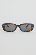 The Malibu Brown Tort Sunglasses bring bold, retro-cool energy to your everyday looks. Featuring a striking tortoiseshell frame and a sleek rectangular silhouette, they balance fashion-forward attitude with easy wearability. The dark tinted lenses keep the finish sharp and versatile, making this pair a go-to for sunny days, weekend plans, and everything in between.

A standout accessory that adds instant style.