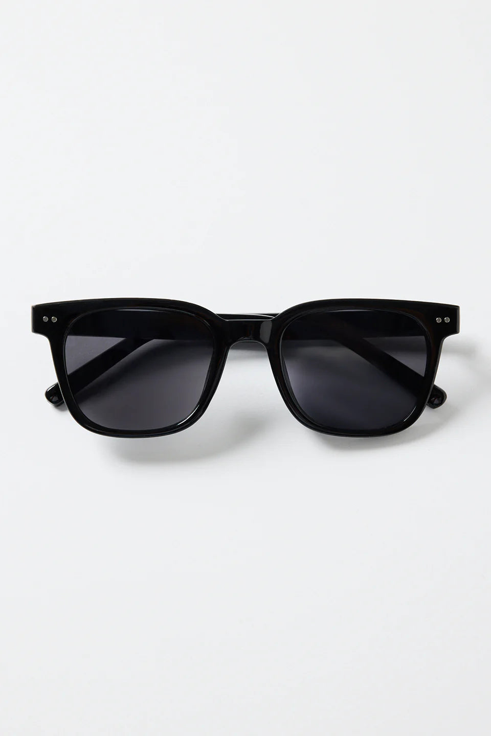 The Monaco Black Classic Sunglasses deliver clean, timeless style with a modern edge. Designed with a sleek black frame and softly rounded square lenses, they offer an effortless, everyday fit that works with absolutely everything. Subtle metal detailing adds a refined touch while the dark lenses keep the look sharp and versatile.

A classic staple made for sunshine, city strolls, and easy weekend wear
