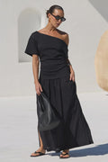 - Asymmetric off-shoulder neckline
- Short sleeves
- Fitted through the waist
- Softly gathered maxi skirt
- Pull-on design
- Natural fibre
- Fabric Composition - 100% Cotton