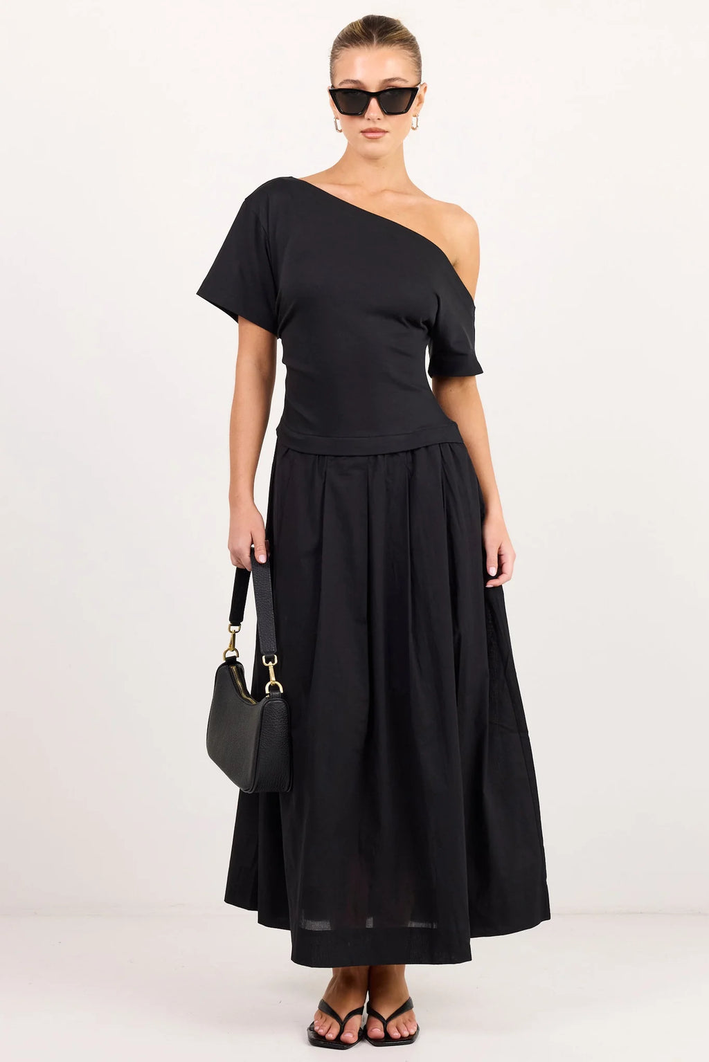 - Asymmetric off-shoulder neckline
- Short sleeves
- Fitted through the waist
- Softly gathered maxi skirt
- Pull-on design
- Natural fibre
- Fabric Composition - 100% Cotton