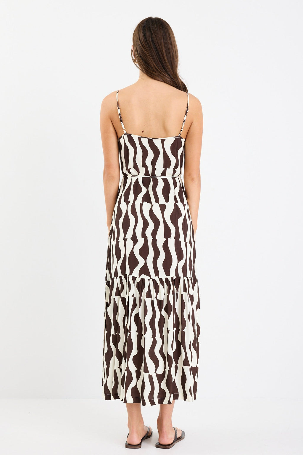 Bold chocolate and cream geometric print

Strappy sleeves for a relaxed summer feel

Tiered design for movement and flow

Lightweight, breathable fabrication

Easy, throw-on silhouette for everyday wear

Fabric Composition
100% Viscose