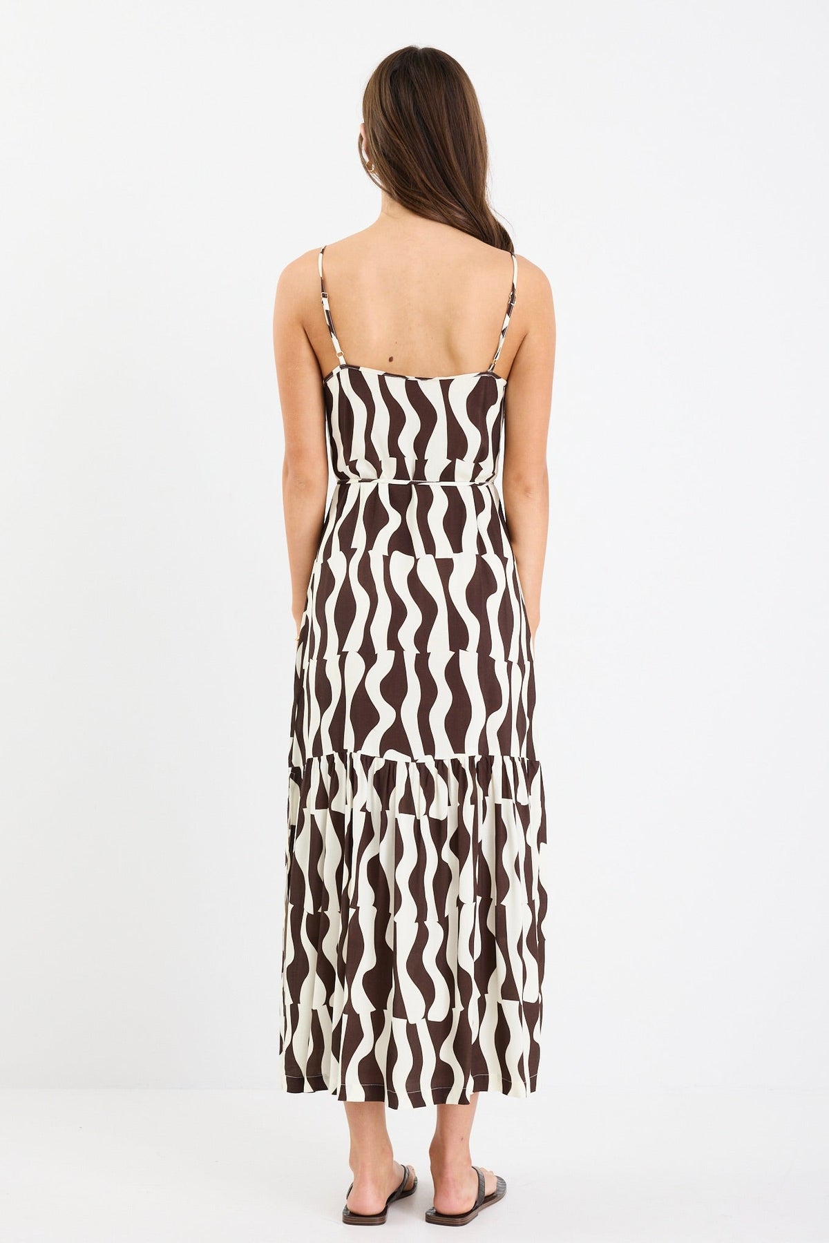 Bold chocolate and cream geometric print

Strappy sleeves for a relaxed summer feel

Tiered design for movement and flow

Lightweight, breathable fabrication

Easy, throw-on silhouette for everyday wear

Fabric Composition
100% Viscose