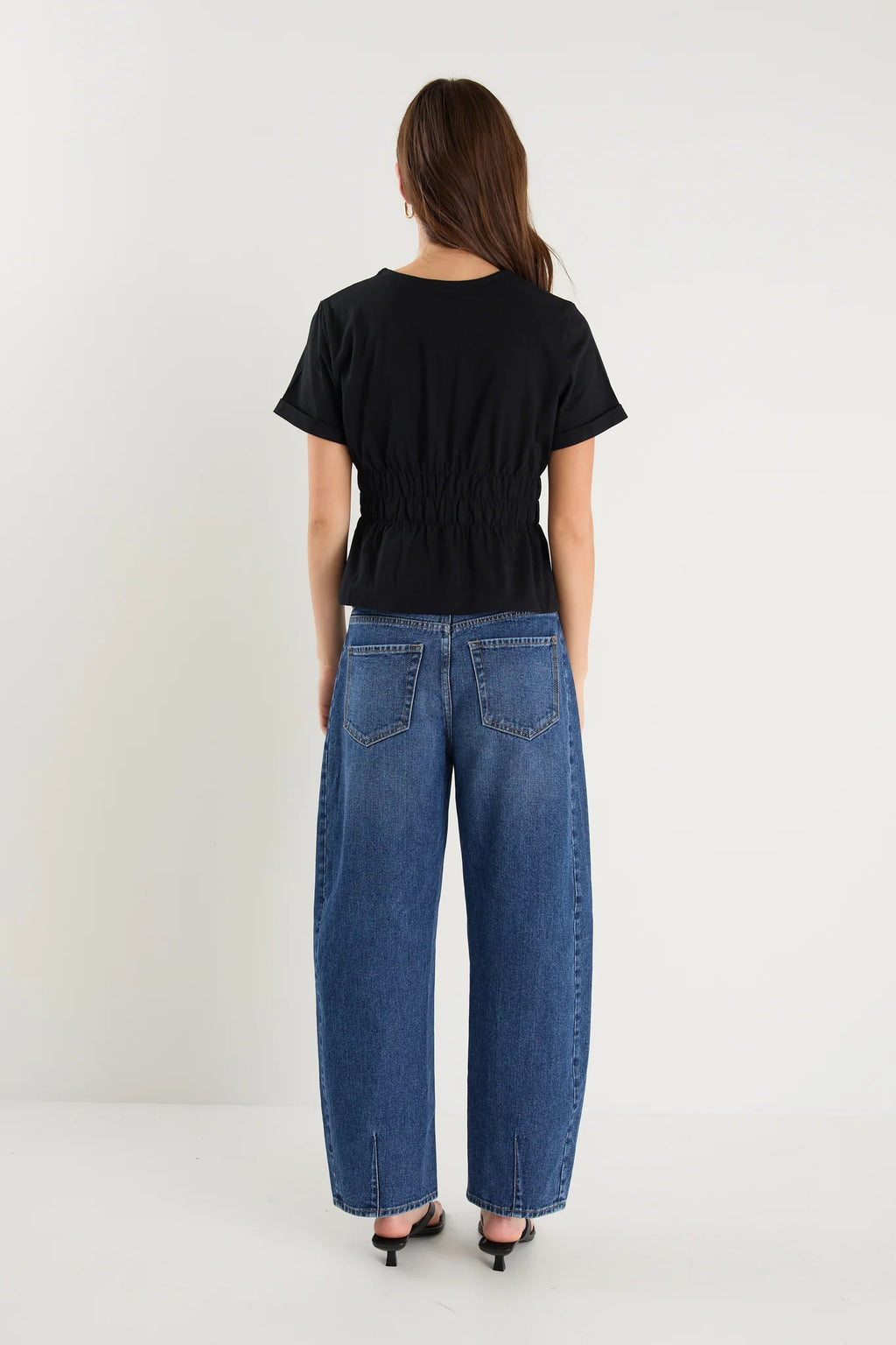 Classic crew neckline for timeless style

Short sleeves with rolled cuffs

Shirred waist detail for a flattering, tailored fit

Flared peplum-style hem for feminine movement

Made from soft, breathable 100% cotton