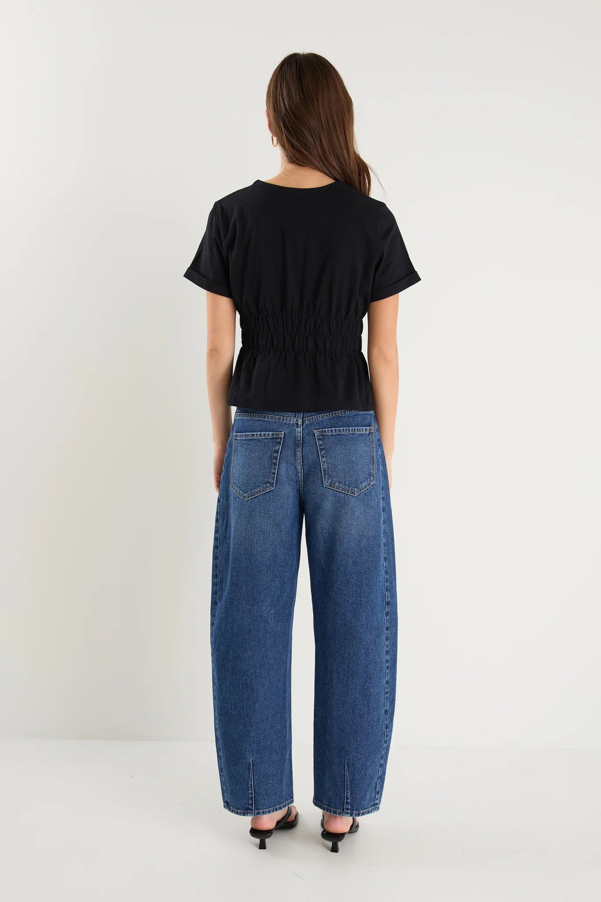 Classic crew neckline for timeless style

Short sleeves with rolled cuffs

Shirred waist detail for a flattering, tailored fit

Flared peplum-style hem for feminine movement

Made from soft, breathable 100% cotton