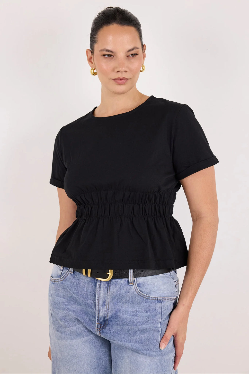 Classic crew neckline for timeless style

Short sleeves with rolled cuffs

Shirred waist detail for a flattering, tailored fit

Flared peplum-style hem for feminine movement

Made from soft, breathable 100% cotton