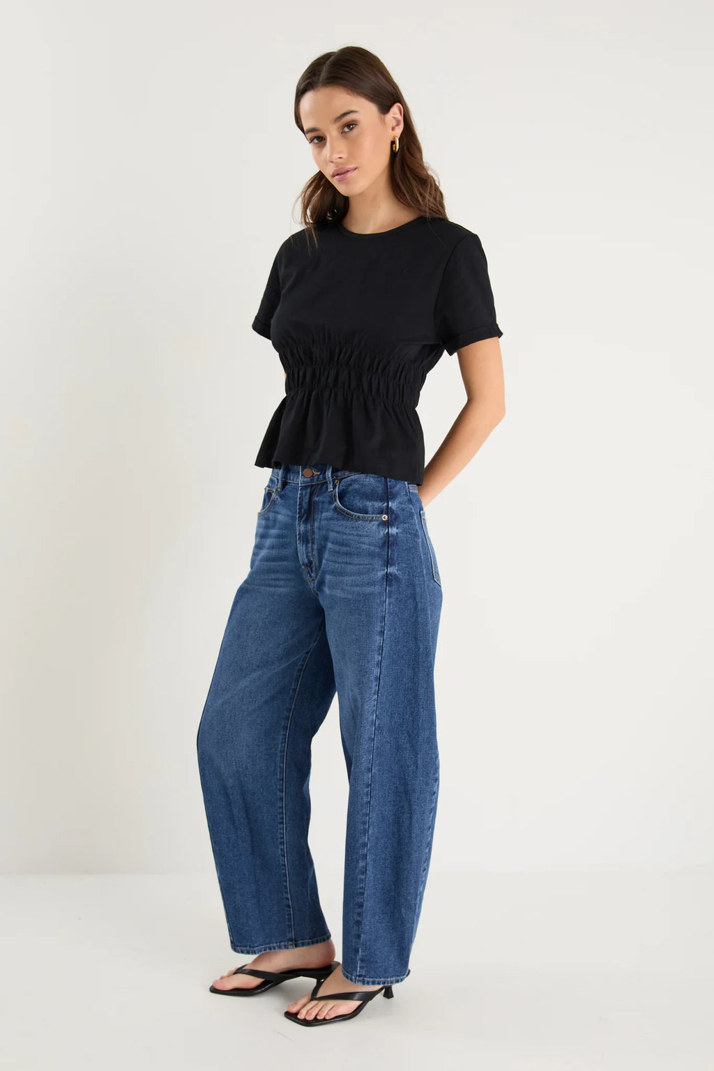 Classic crew neckline for timeless style

Short sleeves with rolled cuffs

Shirred waist detail for a flattering, tailored fit

Flared peplum-style hem for feminine movement

Made from soft, breathable 100% cotton