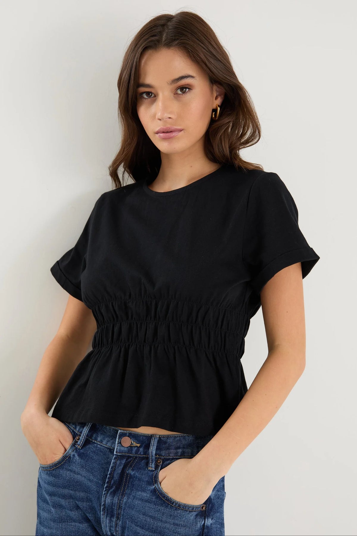 Classic crew neckline for timeless style

Short sleeves with rolled cuffs

Shirred waist detail for a flattering, tailored fit

Flared peplum-style hem for feminine movement

Made from soft, breathable 100% cotton