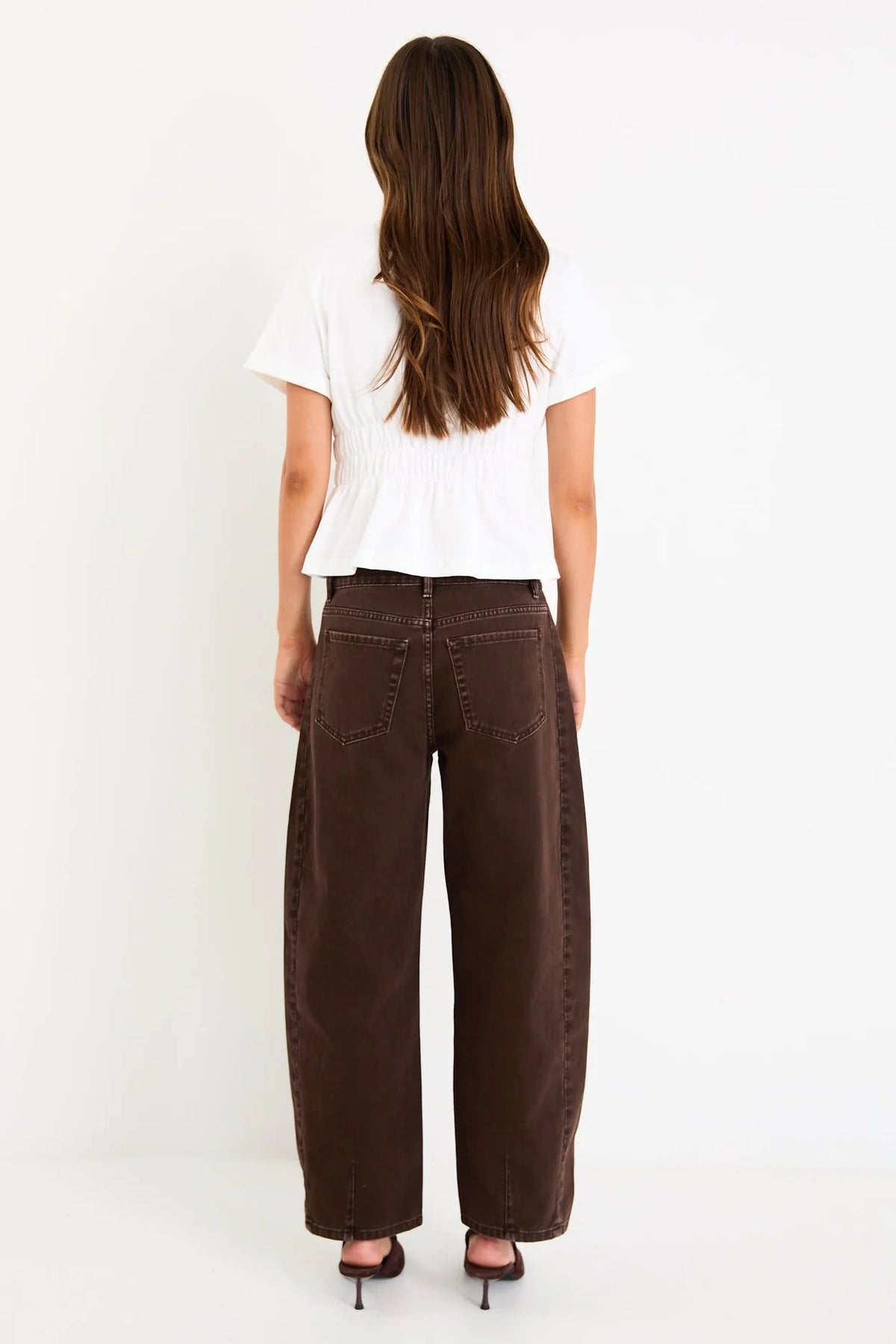 Classic crew neckline for timeless style

Short sleeves with rolled cuffs

Shirred waist detail for a flattering, tailored fit

Flared peplum-style hem for feminine movement

Made from soft, breathable 100% cotton