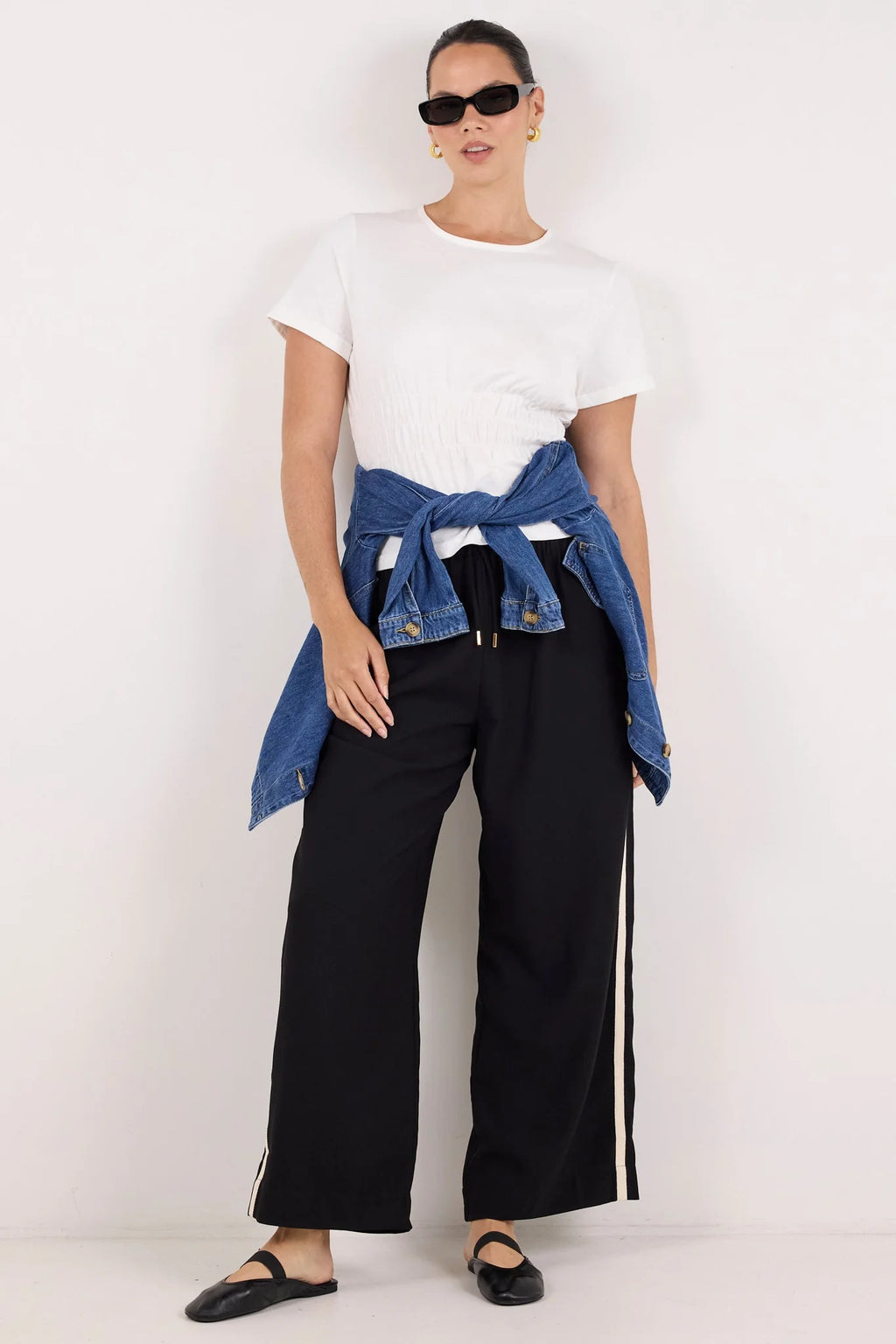 Classic crew neckline for timeless style

Short sleeves with rolled cuffs

Shirred waist detail for a flattering, tailored fit

Flared peplum-style hem for feminine movement

Made from soft, breathable 100% cotton