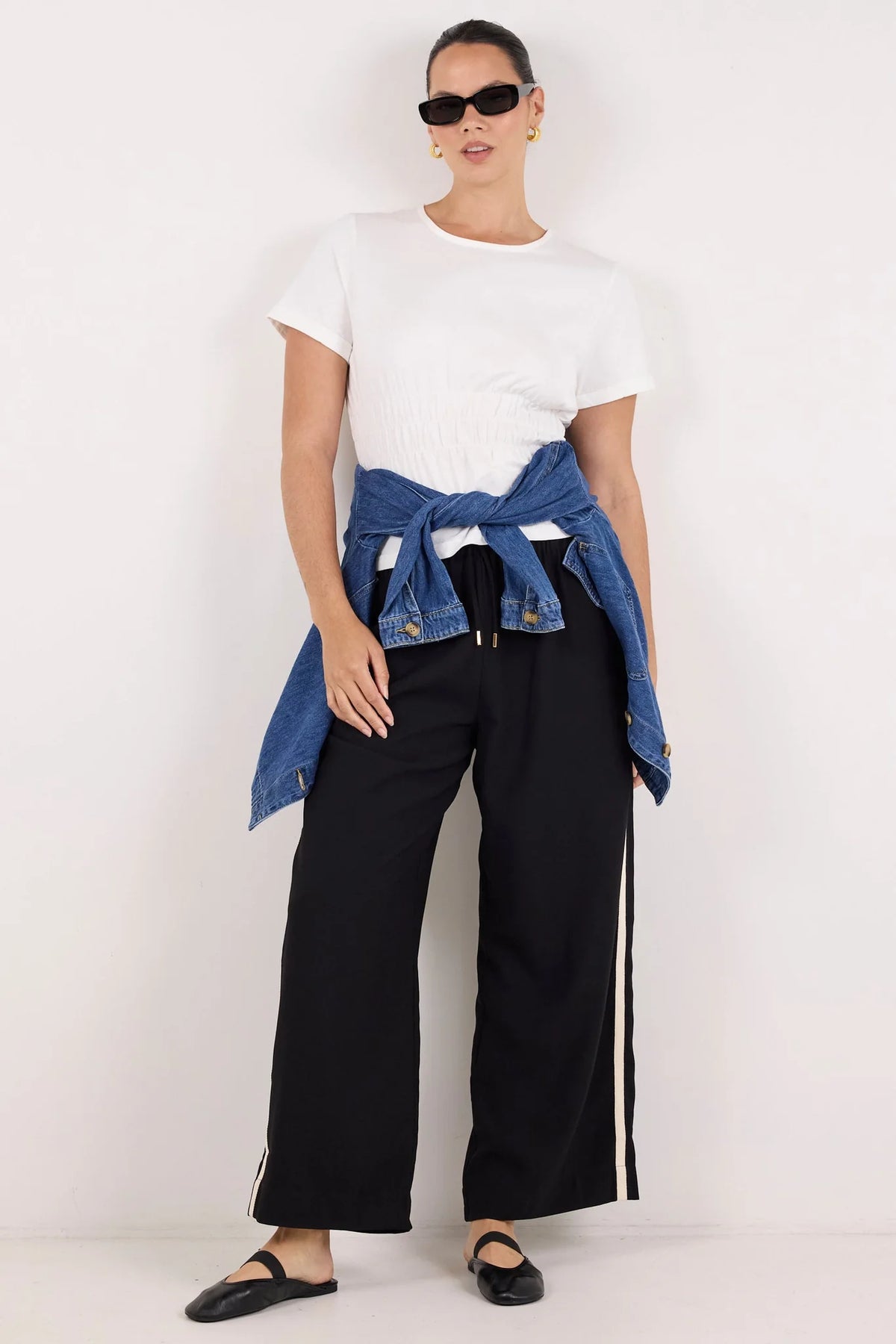 Classic crew neckline for timeless style

Short sleeves with rolled cuffs

Shirred waist detail for a flattering, tailored fit

Flared peplum-style hem for feminine movement

Made from soft, breathable 100% cotton