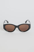 Bold, modern, and effortlessly cool, the Tokyo Black Sunglasses are made to elevate your everyday look. The glossy black frame brings a sleek, sculpted feel, while the rounded cat-eye silhouette adds just the right amount of attitude. Finished with warm brown lenses for a softened contrast, this pair works with everything from laid-back tees to your favourite linen sets.

A statement staple that always looks polished.