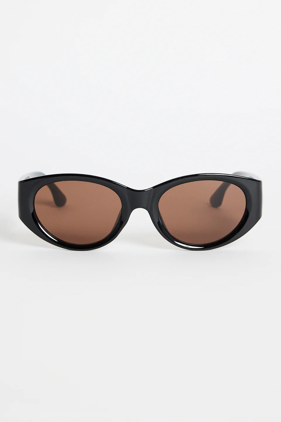 Bold, modern, and effortlessly cool, the Tokyo Black Sunglasses are made to elevate your everyday look. The glossy black frame brings a sleek, sculpted feel, while the rounded cat-eye silhouette adds just the right amount of attitude. Finished with warm brown lenses for a softened contrast, this pair works with everything from laid-back tees to your favourite linen sets.

A statement staple that always looks polished.