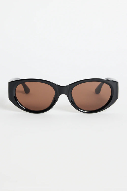 Bold, modern, and effortlessly cool, the Tokyo Black Sunglasses are made to elevate your everyday look. The glossy black frame brings a sleek, sculpted feel, while the rounded cat-eye silhouette adds just the right amount of attitude. Finished with warm brown lenses for a softened contrast, this pair works with everything from laid-back tees to your favourite linen sets.

A statement staple that always looks polished.