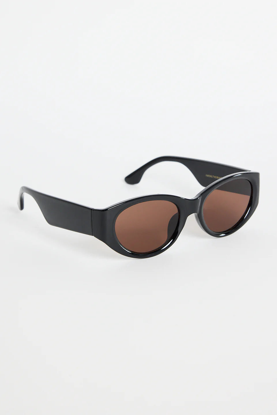 Bold, modern, and effortlessly cool, the Tokyo Black Sunglasses are made to elevate your everyday look. The glossy black frame brings a sleek, sculpted feel, while the rounded cat-eye silhouette adds just the right amount of attitude. Finished with warm brown lenses for a softened contrast, this pair works with everything from laid-back tees to your favourite linen sets.

A statement staple that always looks polished.
