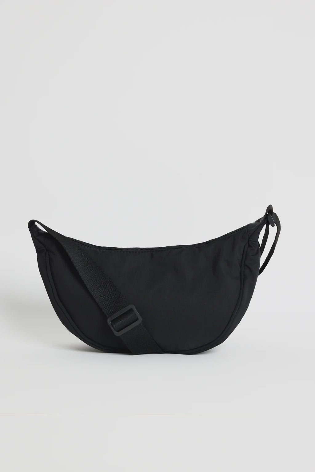 Soft, lightweight fabrication for all-day comfort

Adjustable crossbody strap for a custom fit

Secure zip closure to keep essentials safe

Compact, streamlined shape

Ideal size for everyday use

Measurements

30cm (L) x 16.5cm (H) x 10cm (W)