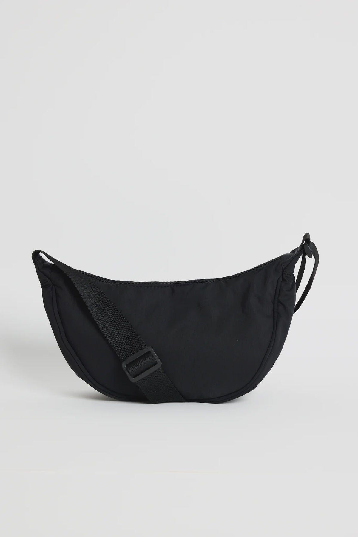 Soft, lightweight fabrication for all-day comfort

Adjustable crossbody strap for a custom fit

Secure zip closure to keep essentials safe

Compact, streamlined shape

Ideal size for everyday use

Measurements

30cm (L) x 16.5cm (H) x 10cm (W)