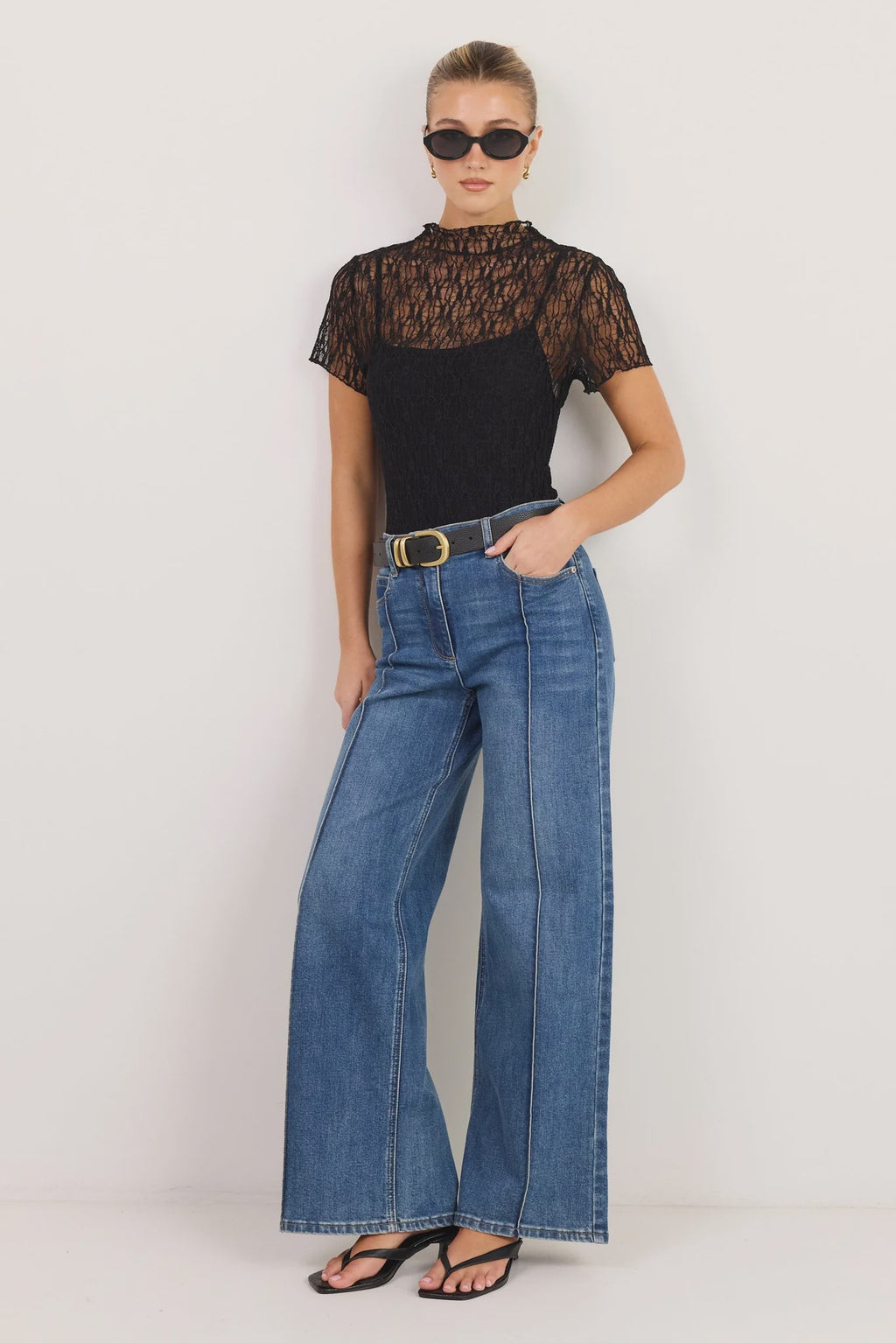 - High-rise fit
- Full-length flared leg
- Front pintuck detailing
- Zip fly with button closure
- Comfort-stretch denim
- Vintage blue wash
- Fabric Composition: 72% Cotton, 27% Polyester, 1% Elastane