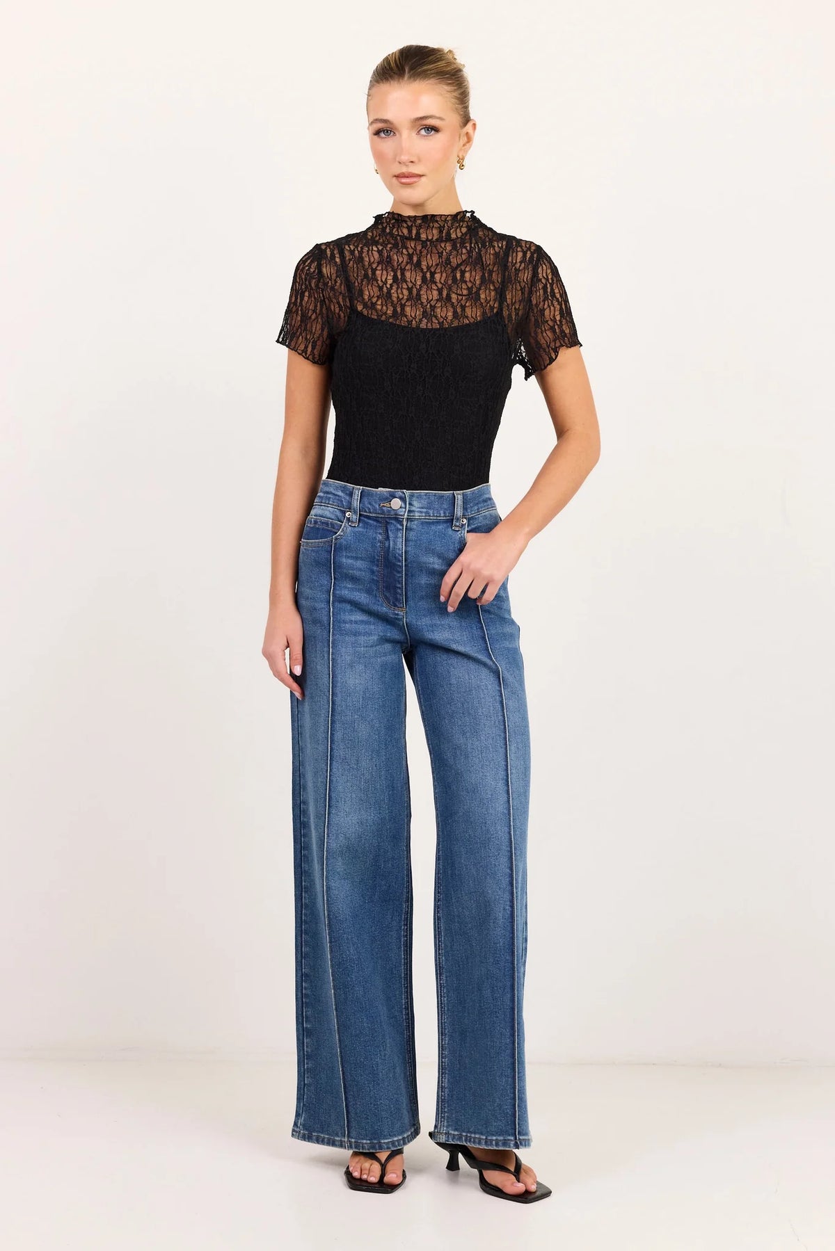 - High-rise fit
- Full-length flared leg
- Front pintuck detailing
- Zip fly with button closure
- Comfort-stretch denim
- Vintage blue wash
- Fabric Composition: 72% Cotton, 27% Polyester, 1% Elastane