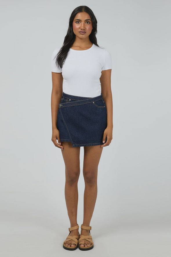 Mid-rise waist for a flattering everyday fit

Crafted from rigid 100% cotton denim

Mini length with hidden skort detail for added coverage

Functional front and back pockets

Stitched hem for a clean, structured finish

Shank button closure for a classic denim look

Vintage wash for an effortlessly cool feel