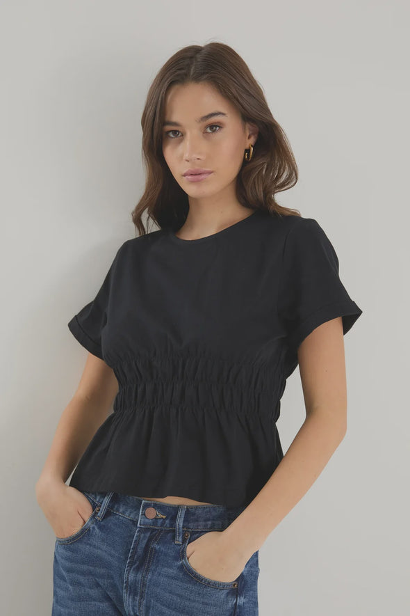 Classic crew neckline for timeless style

Short sleeves with rolled cuffs

Shirred waist detail for a flattering, tailored fit

Flared peplum-style hem for feminine movement

Made from soft, breathable 100% cotton
